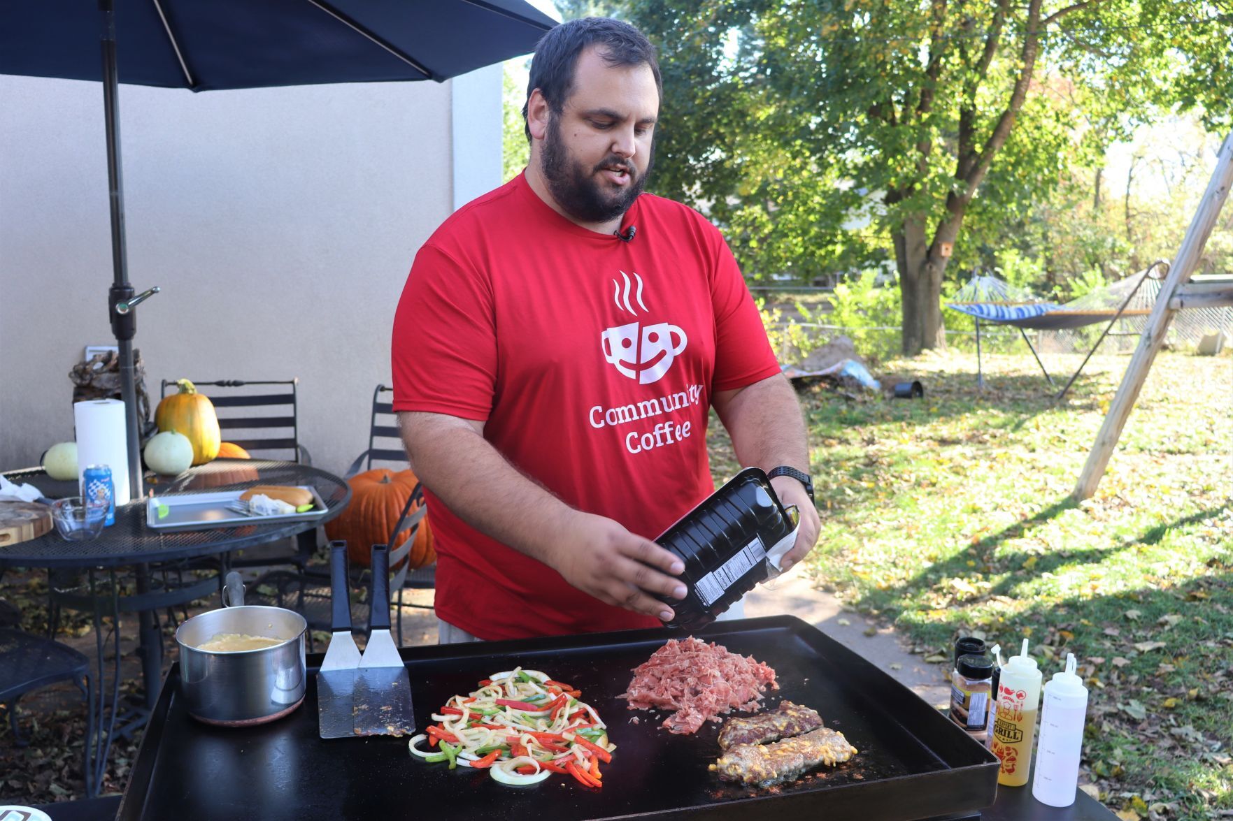 Blake Sykora preparing a Wisconsin cheese steak